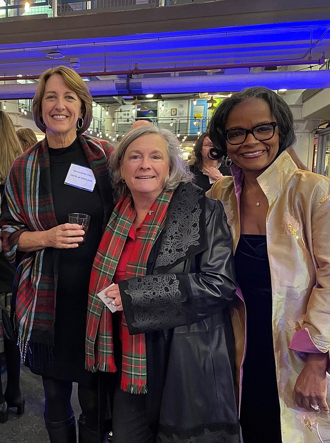 Campagna Center president and CEO Tammy Mann, right, enjoys the Taste of Scotland fundraiser with Bernadette Cala and Ysabel McAleer Dec. 2 at the Torpedo Factory Art Center.
