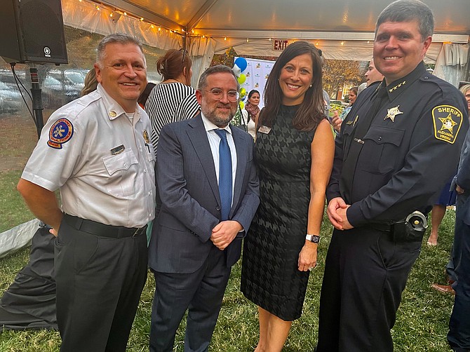 Woodbine administrator Donna Shaw, second from right, celebrates the 30th anniversary of Woodbine Rehabilitation and Health Care Center with Deputy Chief Brian Hricik, Woodbine owner Norman Rokeach and Sheriff Sean Casey Nov. 2.