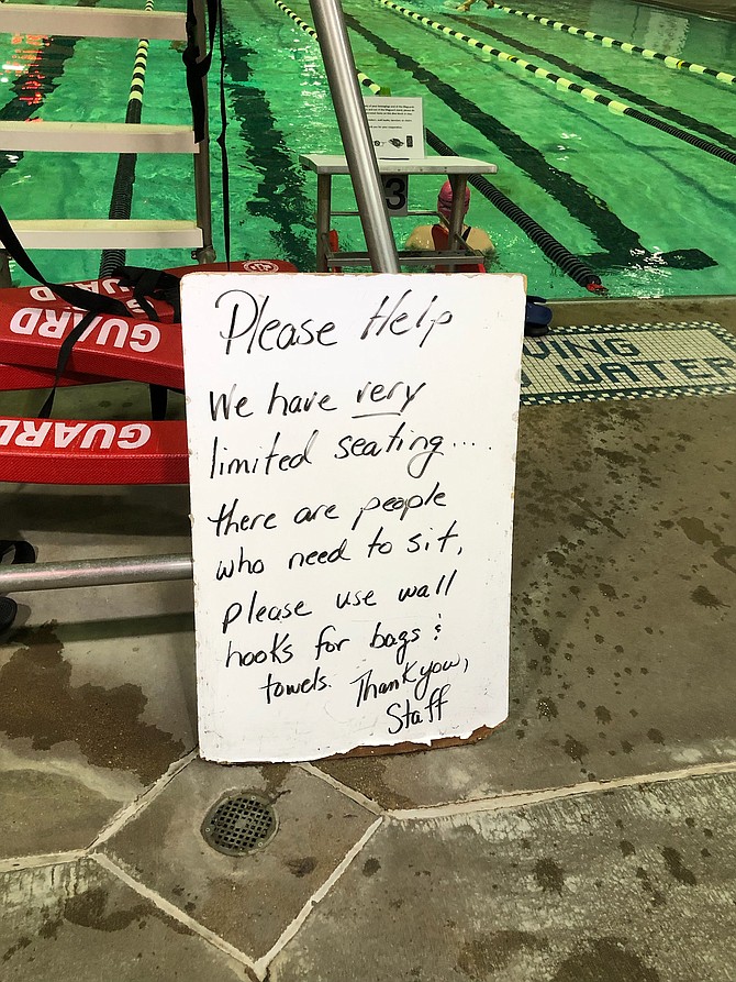 Mount Vernon Rec Pool sign, reflecting “looted” chairs. Photo by Mary Paden