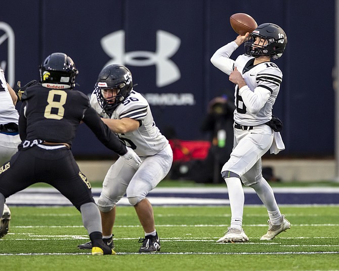 Madison Quarterback Mac Lewis #16 looks downfield for a receiver in state championship game.