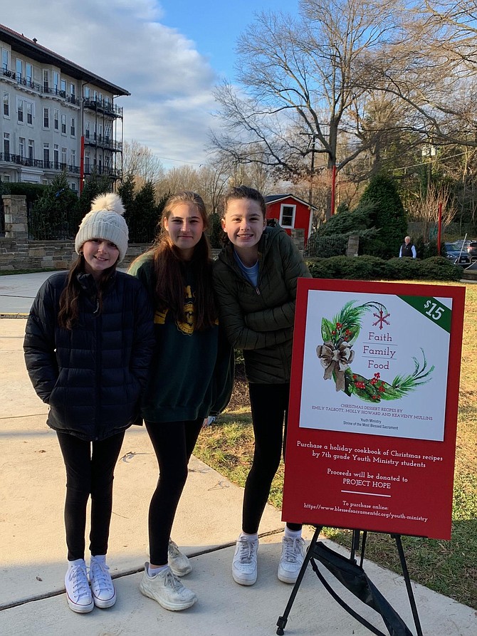 From left, Emily Talbott, Molly Hobart and Keaveny Mullins. The three seventh grade students created a cookbook that is filled with holiday dessert recipes that are part of their family's Christmas tradition.