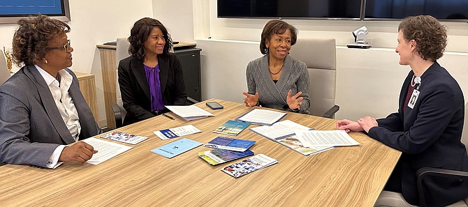 Deborah Tompkins Johnson, second from right, discusses advanced illness care with Audrye Easaw, Bettie Samuel and Jerilyn Rodgers of Capital Caring Health.