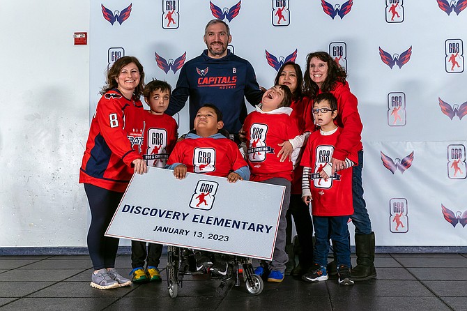 Alex Ovechkin with a small group of students from Discovery Elementary.
