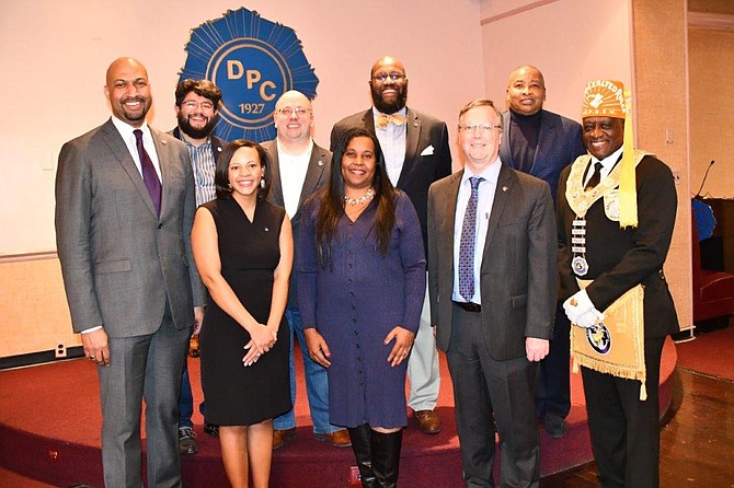 Departmental Progressive Club president Christopher Lewis, left, poses with city officials and elected leaders Jan. 13 at DPC headquarters. With Lewis are (back): Canek Aguirre, Kirk McPike, John Chapman and Merrick Malone. Front: Aliya Gaskins, Charniele Herring, James Parajon and Leonard J. Polk Jr., Grand Exalted Ruler of the Improved Benevolent Protective Order of Elks of the World.