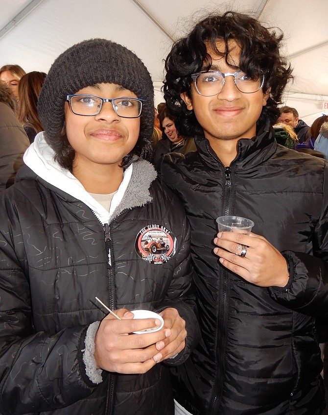 From left, brothers Ayan and Sohal Sudheer with, respectively, a hot chocolate bomb drink and chocolate soda.