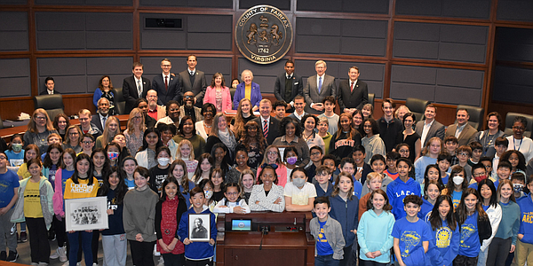 Students, teachers and others involved in the  Historical Marker Project launched as part of the Black/African American Experience Project  gather at the dais after the Fairfax County Board of Supervisors  recognized them at its Feb. 7 meeting.
