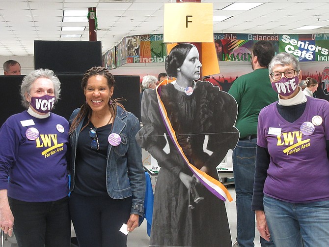 Fairfax League members had a life-size cutout of suffragist Susan B. Anthony at Supervisor Dan Storck's Feb. 11 town meeting. Here, left to right, Elizabeth Woodruff, Teresa Knox, "Susan B. Anthony" and Arina van Breda.