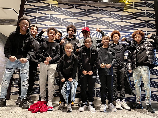 Members of the Alexandria Boxing Club pose for a photo prior to a special screening of Creed III Feb. 28 at the Alamo Drafthouse Cinema in Crystal City.