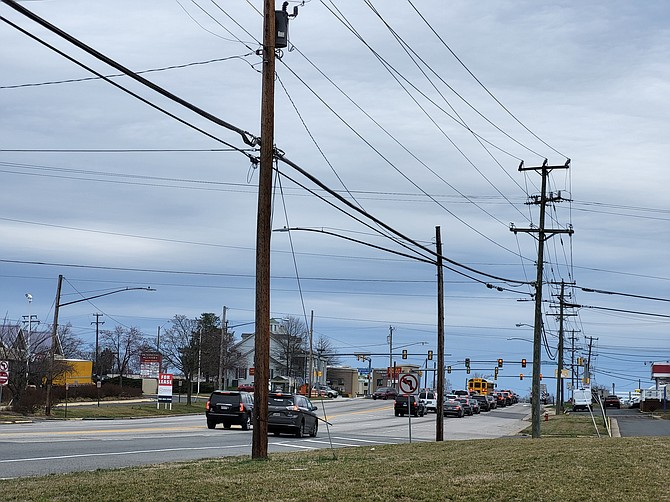 In some places, the utility poles go right up to the road.