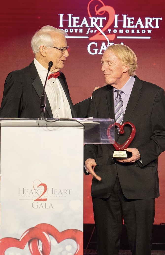 Dr Gary Jones presents Youth For Tomorrow 2023 Heartbeat award to Sen. George Barker who represents part of City of Alexandria, Fairfax and Prince William counties.
