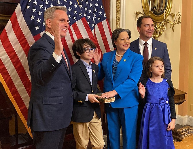 Congresswoman Jennifer McClellan at her official swearing in with the House Speaker and her husband Dave Mills and her children Samantha and Jackson.