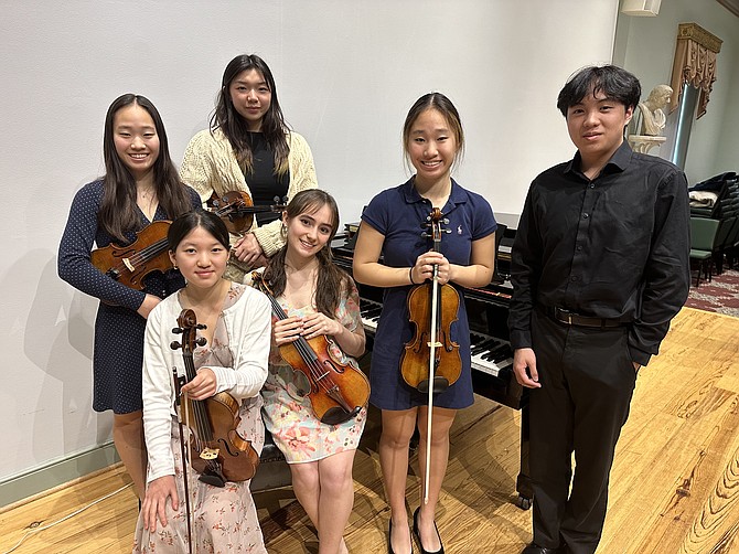 James Bland Music Competition contestants (standing) Kate Liang, Clara Do, Mallory Liang, Kenneth Duong, (sitting) Chole Lee and Colleen Duggar pose for a photo at the competition celebration Feb. 19 at the Lyceum.