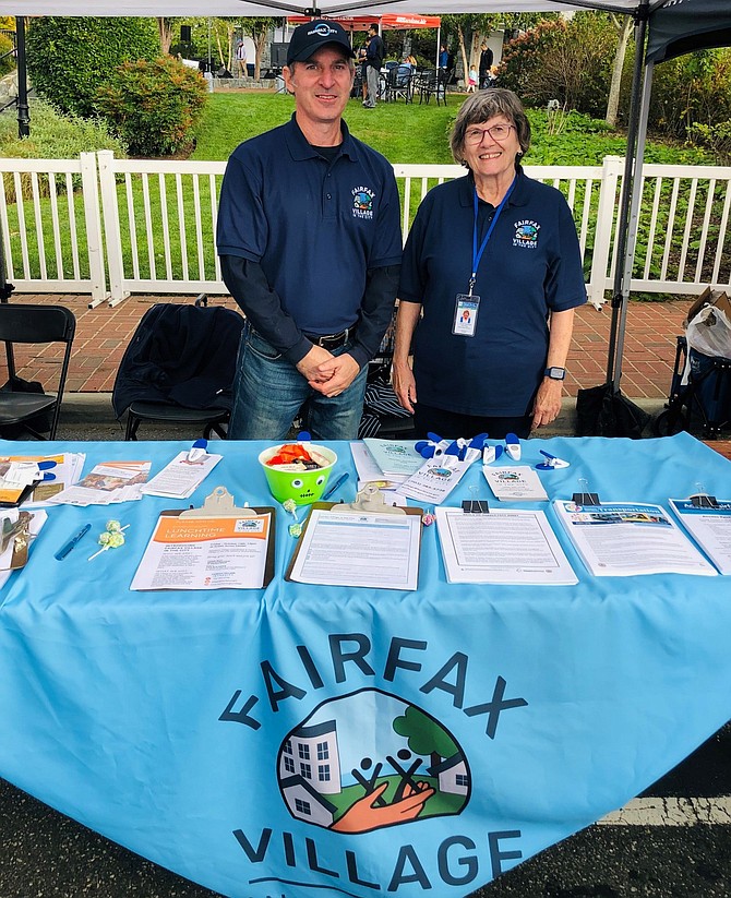 Jason Scadron and Carolyn Sutterfield at the Fairfax Village’s information table at the City’s Fall Festival.
