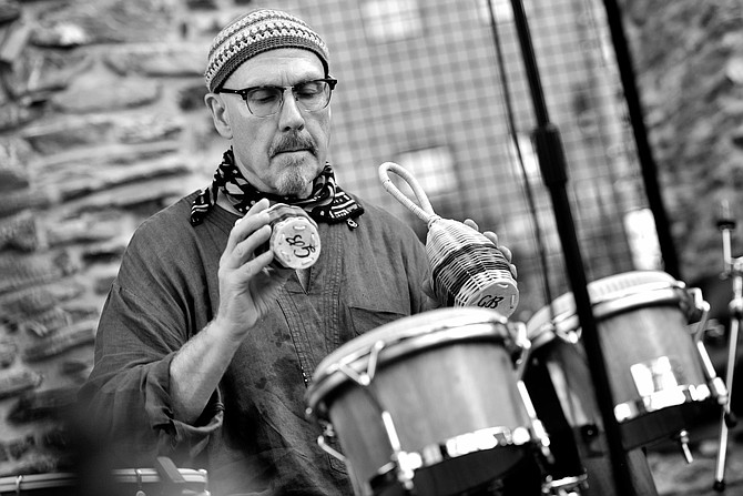 Tom Teasley is big on hand drums and cymbals of all sizes.