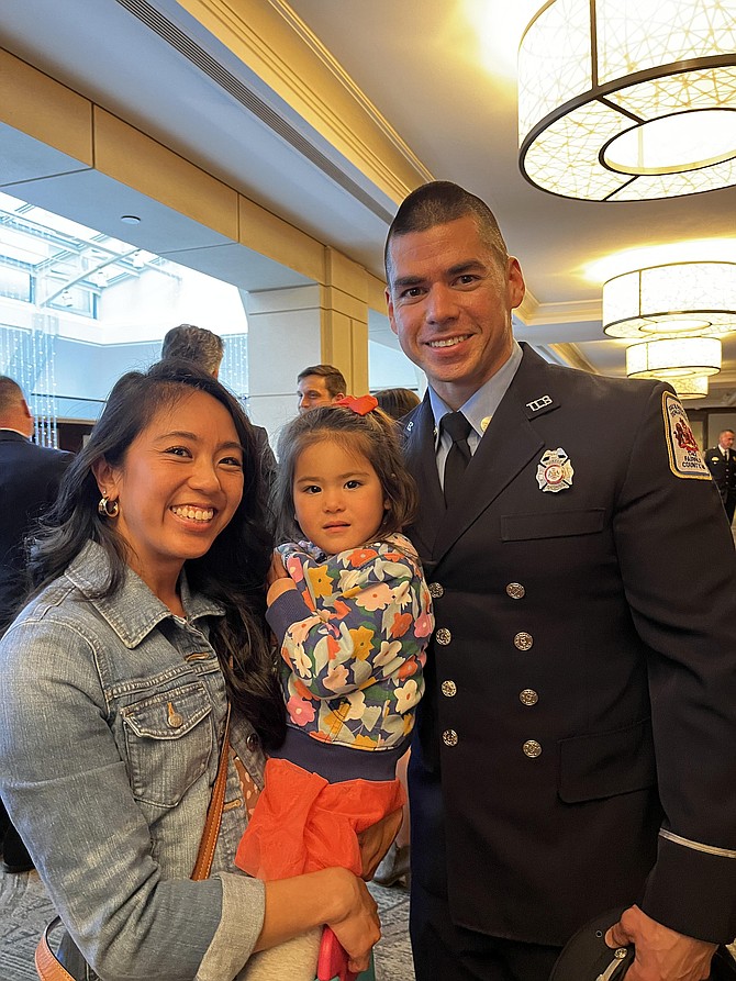 Silver Medal of Honor recipient Technician Sean O'Neill of the Fairfax County Fire & Rescue Department with his family.