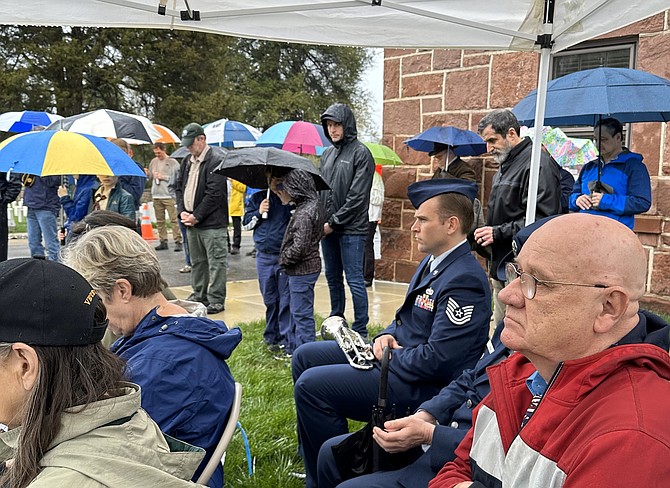A crowd of close to 100 braved the rain to honor Vietnam veterans April 1 at Alexandria National Cemetery.
