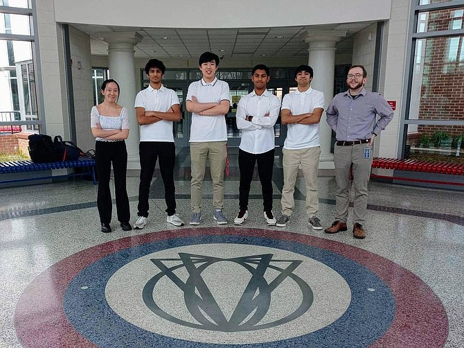 Thomas Jefferson team, from left: Laura Zhang of Vienna; Om Gole of Fairfax; Jerry Sheng of Fairfax; Rishabh Prabhu of Vienna; and Rishabh Chhabra of Herndon. Math teacher Quinn McFee on right