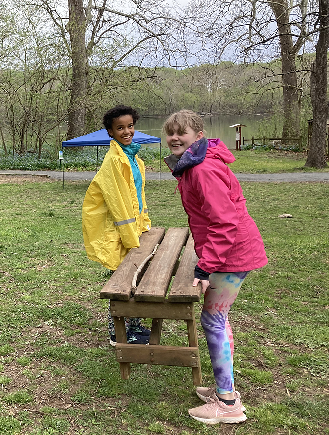 Members of the Climate Conservation Club at Great Falls Elementary School help set up for the Bluebell Walk at Riverbend Park.