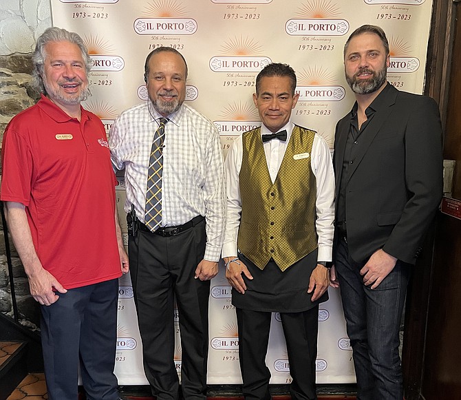 Il Porto Ristorante owners Akbar Zadran, left, poses for a photo with general manager Lou Fellah, head waiter Jesus Perla, and brother and co-owner Wali Zadran in preparation for the upcoming 50th anniversary celebration April 26.