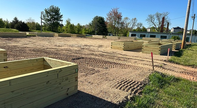 Raised beds are placed in the prepared area nearby former minimum security prison dormitories from the site’s days as part of Lorton Prison