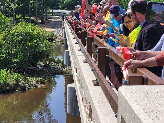 The golden scissors were in the hands of Delegate Kathy Tran (D-42), Bruce Wright from FABB, Fairfax County Chairman Jeff McKay (D), Supervisor Dan Storck (D-Mount Vernon) and many more. Beforehand they were instructed to hold on to the ribbon pieces and not pollute Dogue Creek.