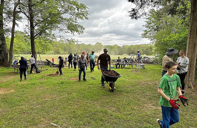 Volunteers help with the cleanup event in Centreville’s Bull Run Regional Park.
