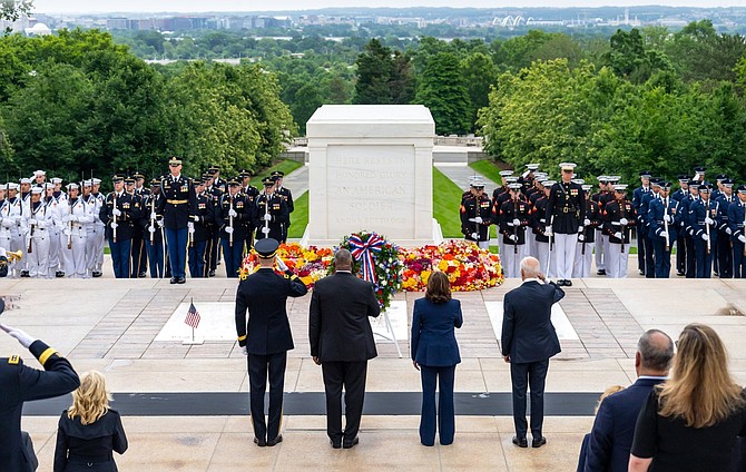 President Joe Biden, Vice President Kamala Harris and Secretary of Defense Lloyd Austin pay respects at the Tomb of the Unknown Soldier May 29 at Arlington National Cemetery.