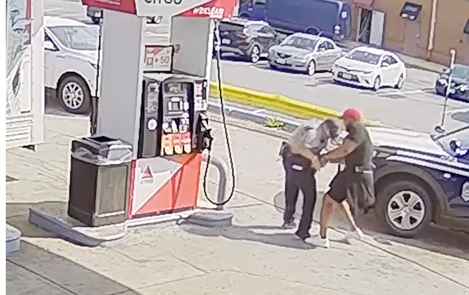 Screenshot via FCPD video shown at press conference
Gas station security footage: Officer #1 attempts to detain Lemagne to further the possible theft investigation, but the incident deteriorates as he fails to cuff Lemagne. They struggle as Lemagne attempts to grab the officer’s service revolver.