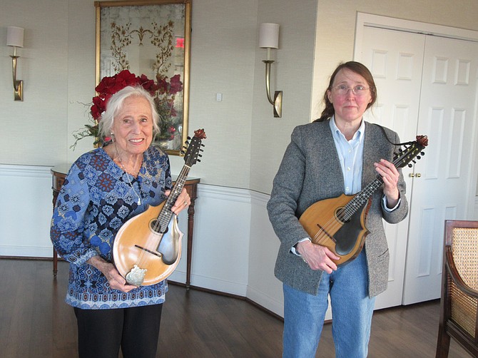 Mandolin musicians Lynn Falk and Kathleen Graham with their vintage mandolins.