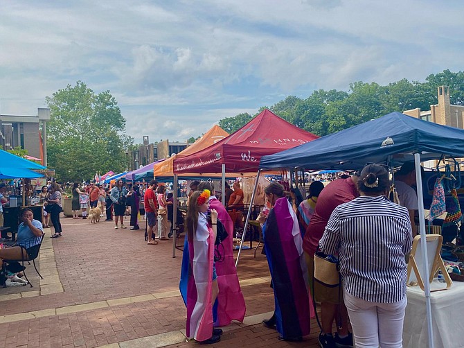 Various vendors and organizations set up booths or tables around Lake Anne and Lake Anne Plaza for the Pride Festival.