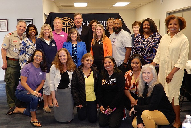 Sen. Mark Warner with some of WFCM’s partners and staff members.