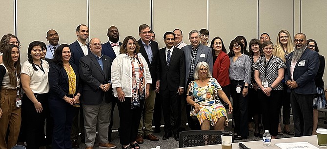 U.S. Sen. Mark Warner joins city officials and board members of Neighborhood Health at a roundtable discussion on community health June 16 at the Del Pepper Community Resource Center.