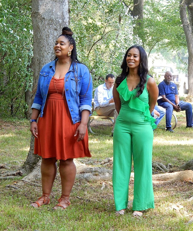 Candice McKinney, left, and Winter Harris sing “Amazing Grace.”