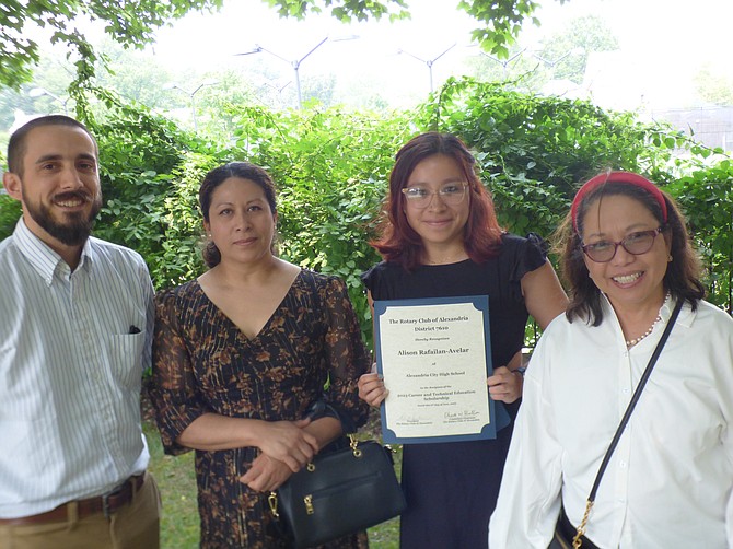 Alison Rafailan-Avelar, a recent ACHS graduate, stands with family members after receiving a $2,500 vocational scholarship from the Alexandria Rotary Club.
