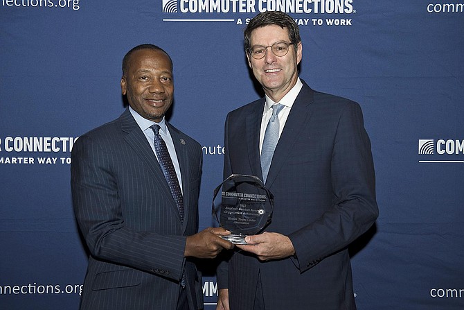RTCA Executive Director Robert Goudie receives the 2023 Employer Services Organization Achievement Award from Reuben B. Collins II, Esq, Chair of the National Capital Region Transportation Planning Board at COG and President of the Charles County Board of County Commissioners.