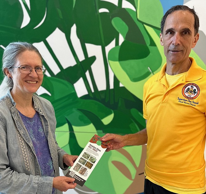 Margaret Fisher, Plant NOVA Natives, shares the Tree Rescuer campaign’s door hanger brochure for home owners with Supervisor Dan Storck