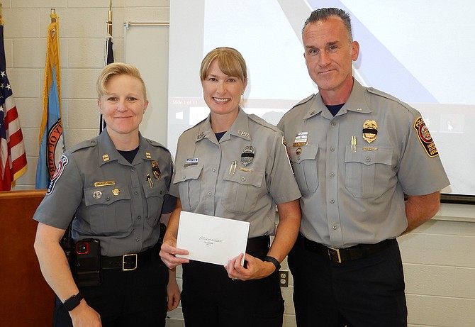 Flanked by Capt. Rachel Levy and Lt. Matt Dehler, MPO Sabrina Ruck (center) is honored as Officer of the Quarter.