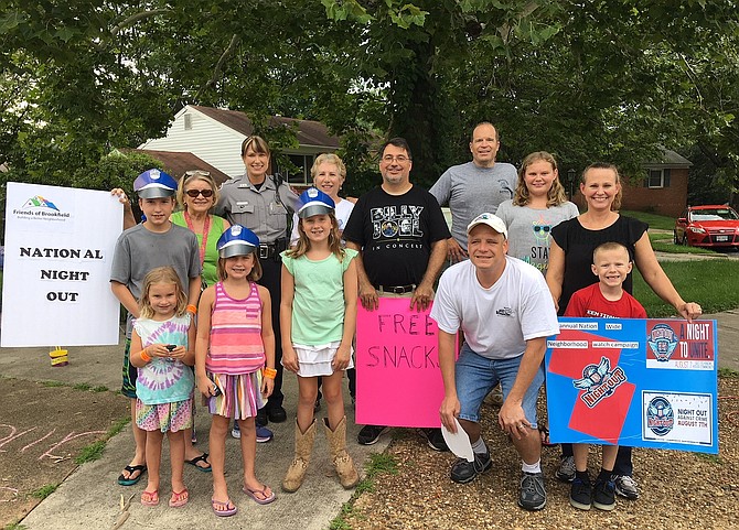 MPO Sabrina Ruck (back row, far left) joins Brookfield parents and children at a past National Night Out celebration.