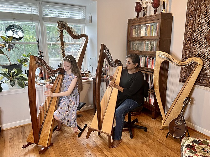 Student harper Veronica Sachse, 12 of Vienna, and her teacher, Shyamali Roy Hauth of Reston