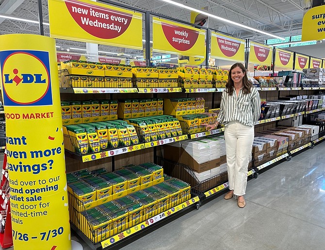 Lidl spokesperson Chandler Spivey helped customers locate areas around the store including their middle aisle where non-grocery bargains are renewed each Wednesday, often including seasonal items, like these school supplies
