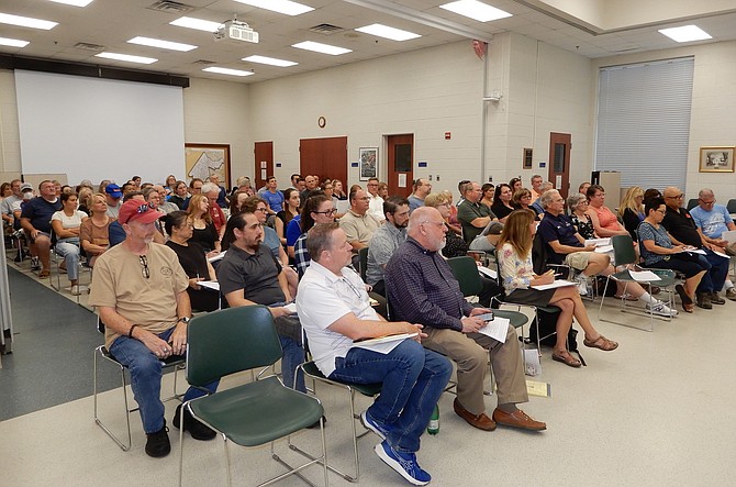 Residents listen intently to the presentation about the data center.