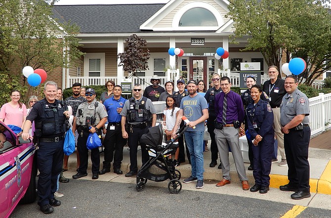 The Elms: Residents and law-enforcement officers celebrate together during National Night Out.