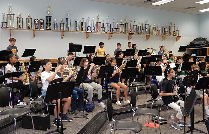 Beneath Franklin Middle School’s many music trophies, the Concert Band plays.