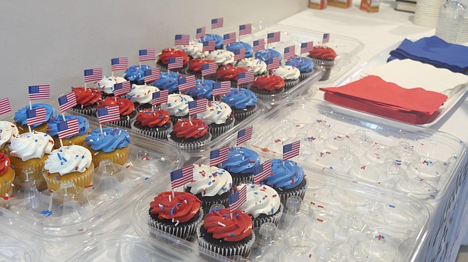 Red, white and blue cupcakes are spread out to welcome the new citizens and their families after the ceremony.