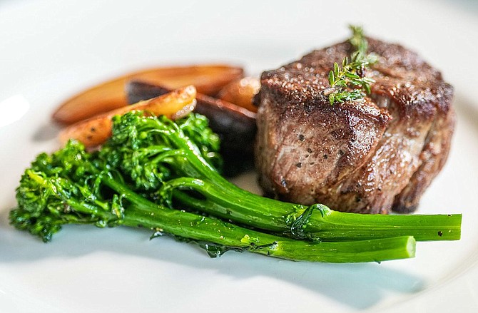 Draper’s Steak and Seafood’s petite filet mignon with roasted fingerling potatoes, broccolini and demi-glace.