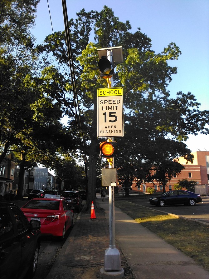 Four years later the sign has been moved into the sun. The orange pylon is in the shade, where the signal had been originally installed.