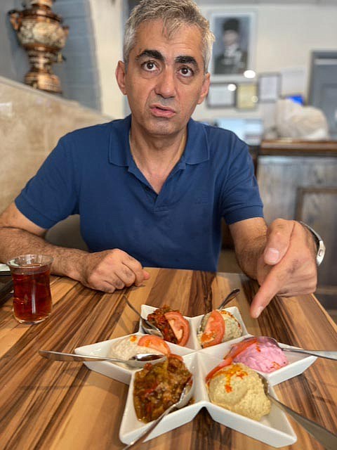 Turgut Yigit, owner of Istanbul Grill on Wilson Boulevard., with mezze platter, a customer favorite