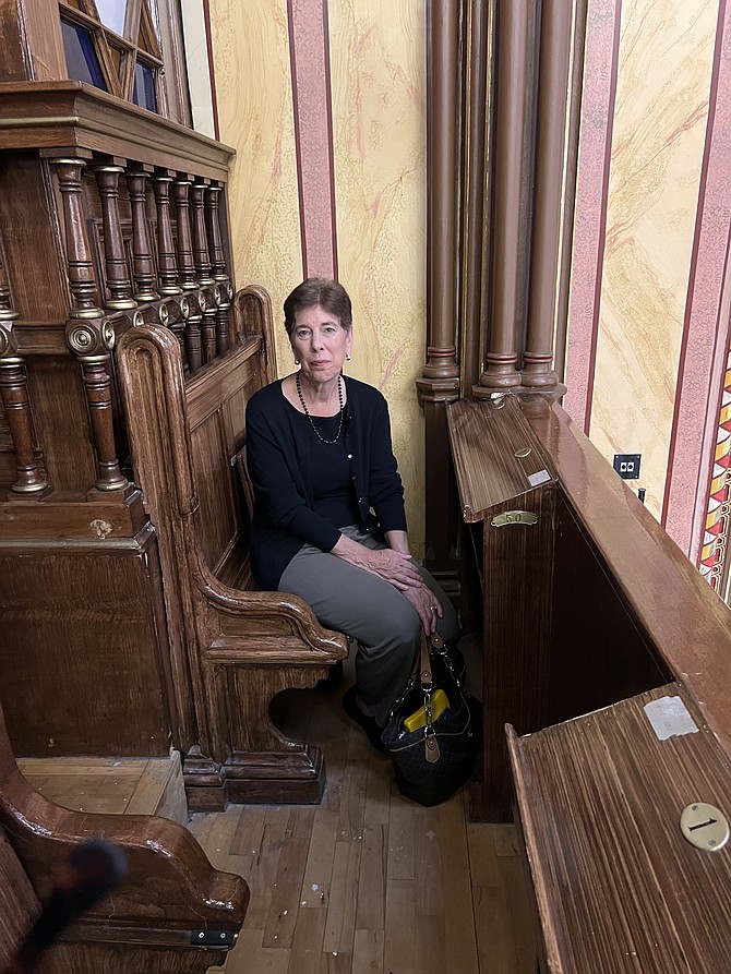 Linda Ambrus Broenniman, a Great Falls resident and author of “The Politzer Saga,” released Sept. 12, sits in her great-grandmother Margit’s seat at the Dohány Street Synagogue within blocks from the Rumbach Synagogue in Budapest, Hungary.