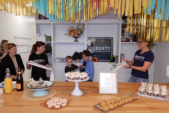 Cutting the ribbon on the bakery are (from left) Catherine Read, Alison Friedman and sons Jude, 8, and Oliver, 10, and Kim Schaeffer.