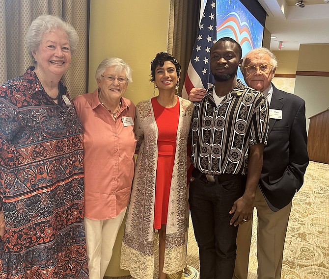 New U.S. citizens Nada Boris, center, and Melvin Palmer, second from right, celebrate their citizenship with tutors Judy Hansen, Pat Gottemoeller and Mark Raabe Sept. 18 at Goodwin House Alexandria.